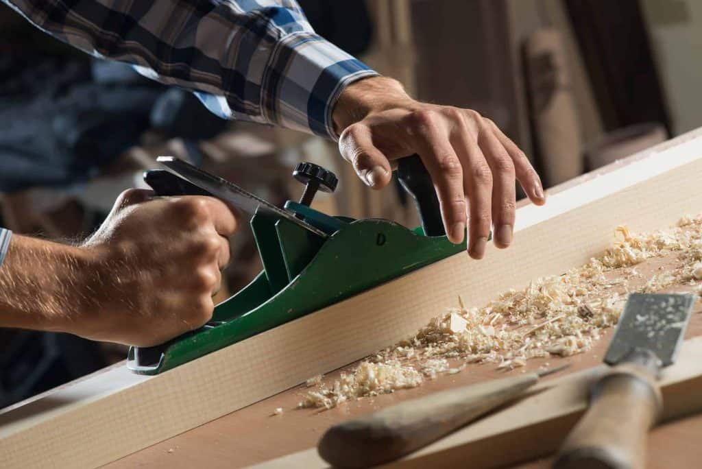 a man using a jointer