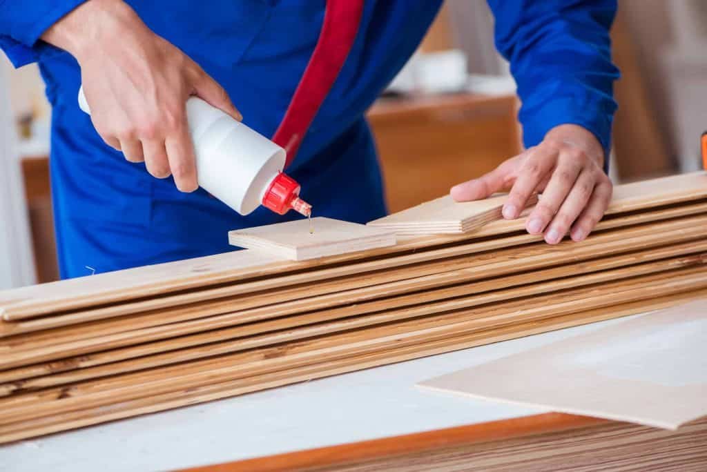 carpenter using wood glue