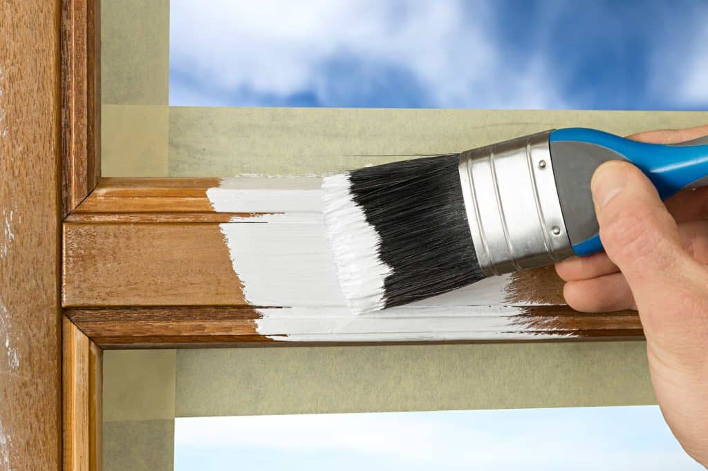painting a wooden window trim after sanding