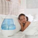 little girl sleeping in the bedroom with air humidifier