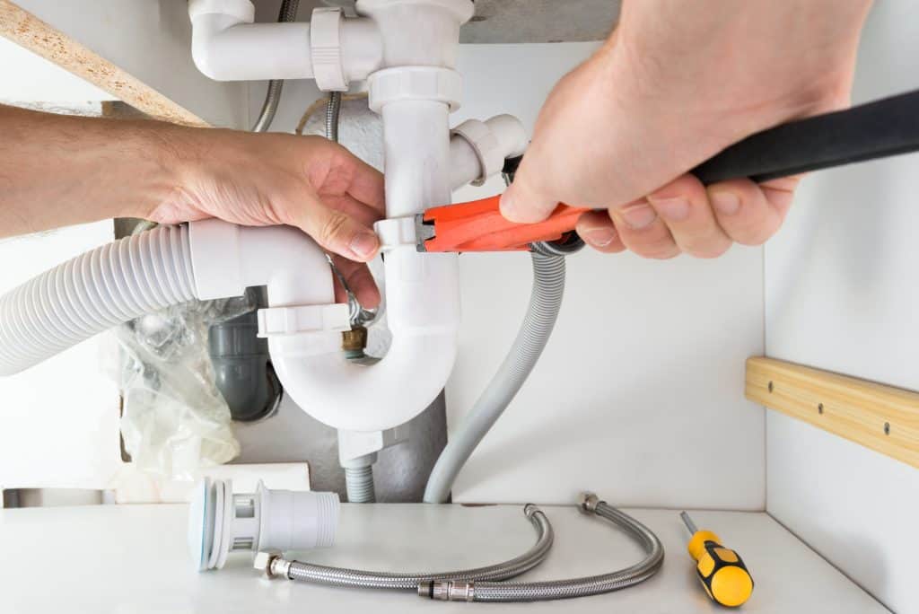 plumber replacing a p-trap