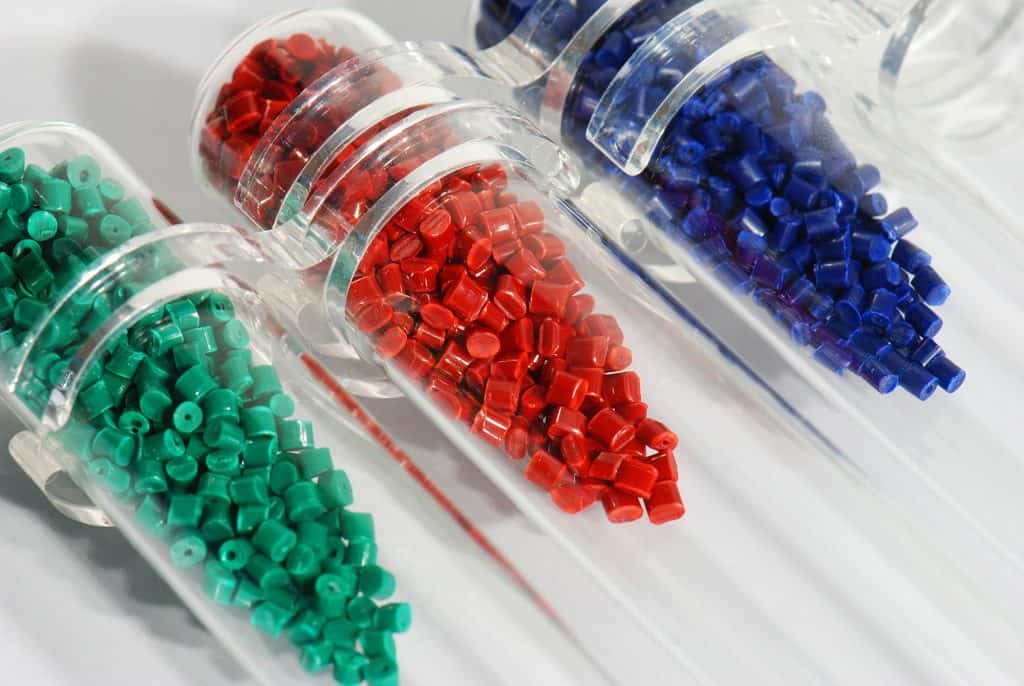 green, red and blue resin polymers in test tubes