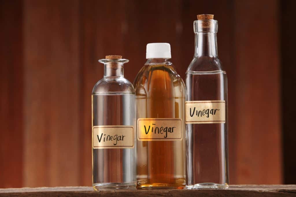 three bottles of vinegar