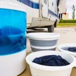washing machine and bowl of clothes outside the house
