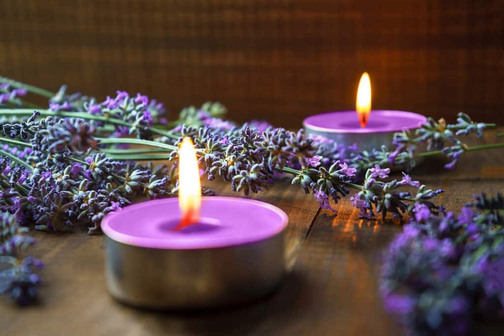 scented lavender candles on wooden table