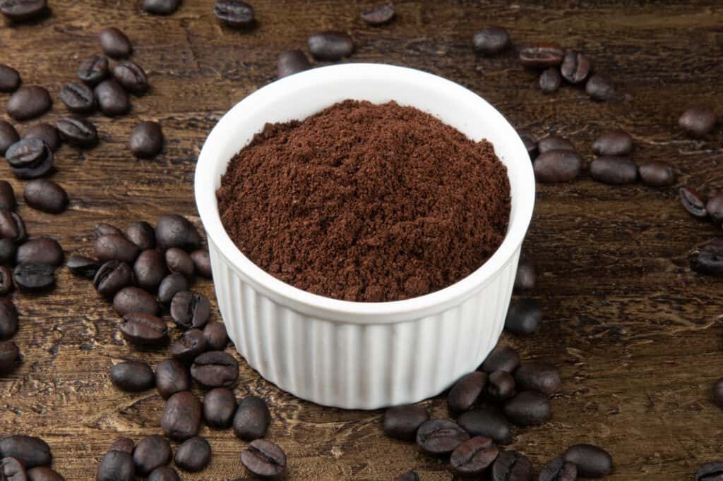 ground coffee in a white bowl