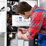 Technician checking boiler