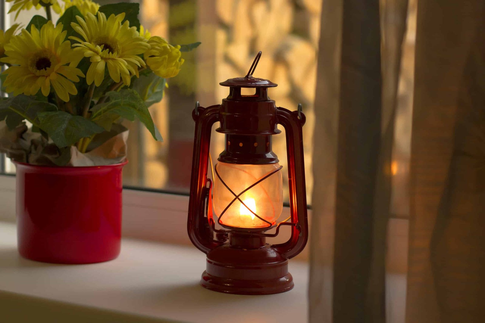 Kerosene lamp on the window. Old lamp